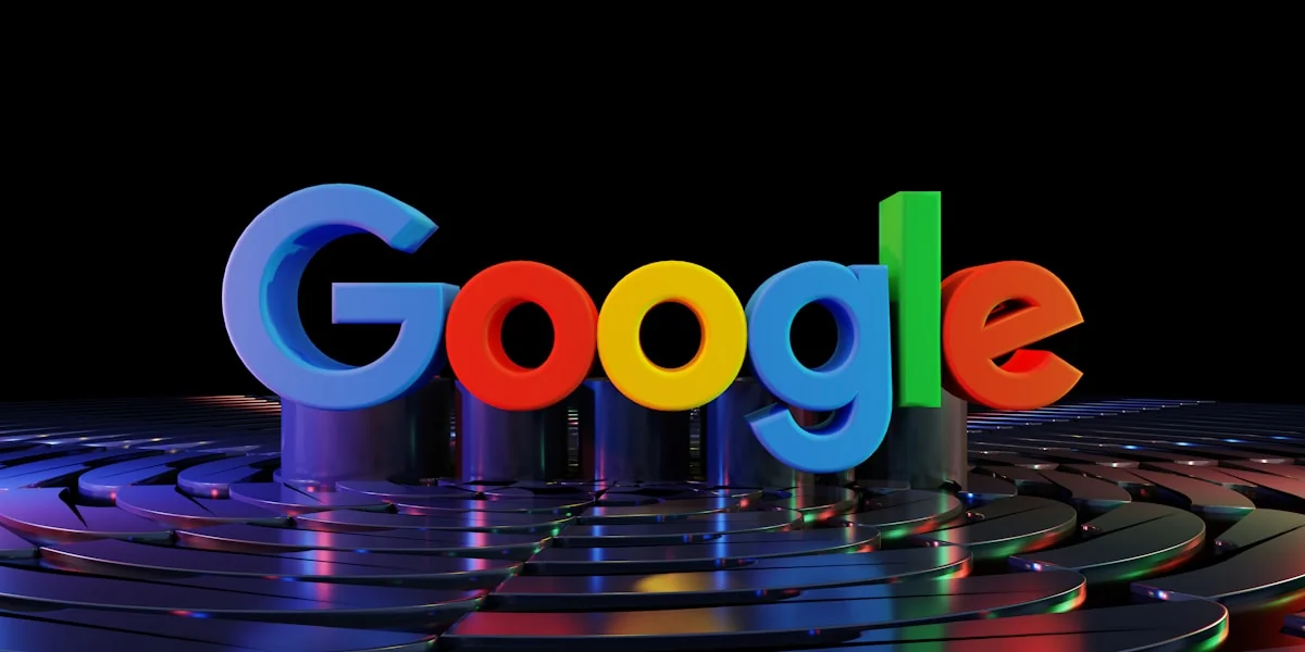 the google logo is displayed in front of a black background