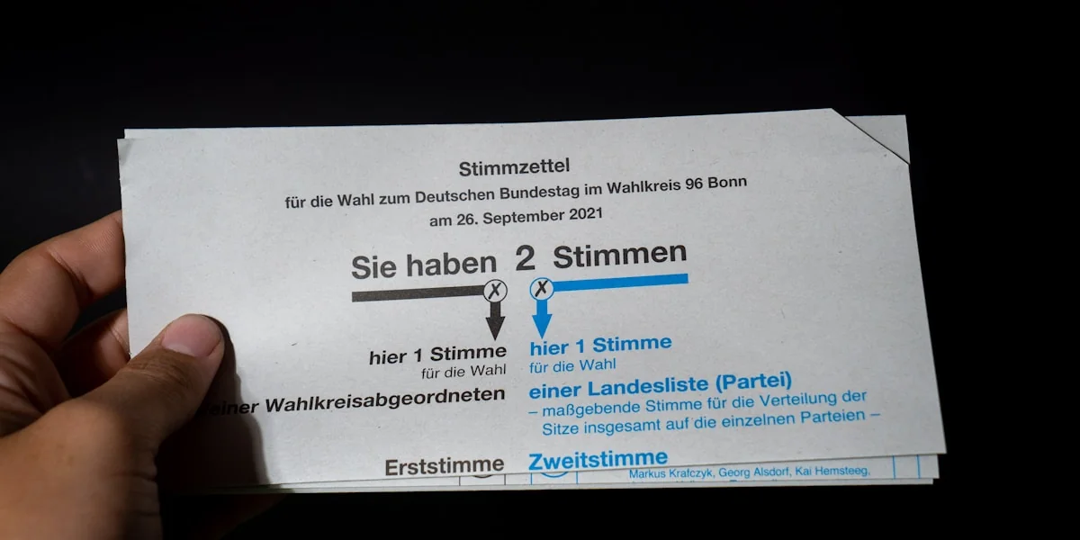 a person holding up a ticket for a concert