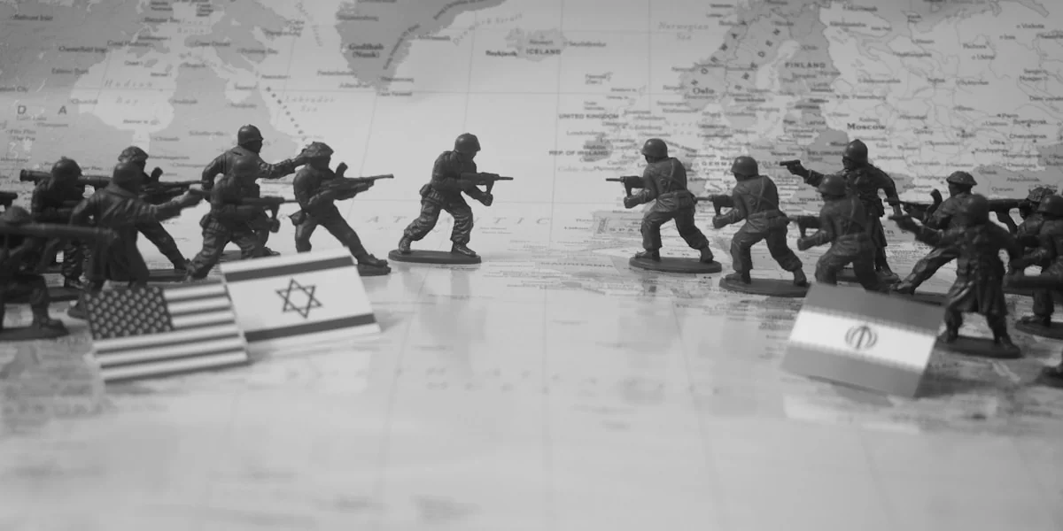 Toy soldiers in formation with flags on world map