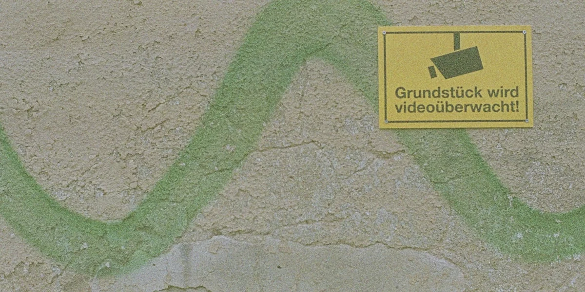 a yellow sign on the side of a building