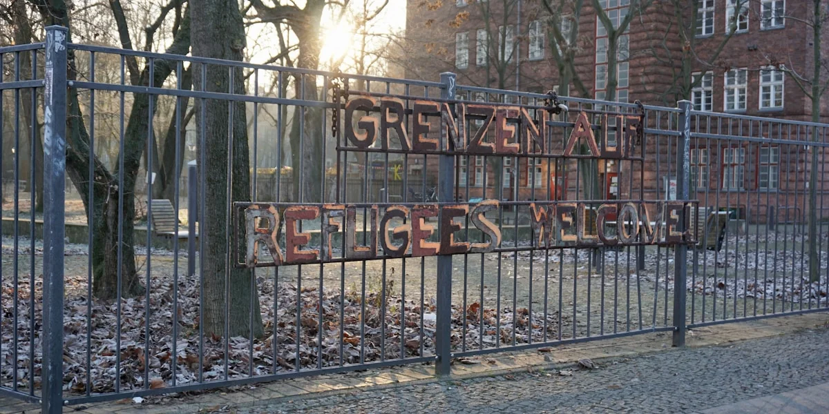 a fence that has a sign on it