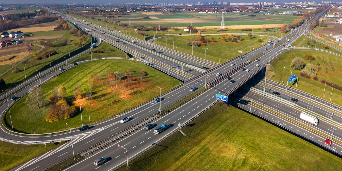 Aerial view of a complex highway interchange with cars.