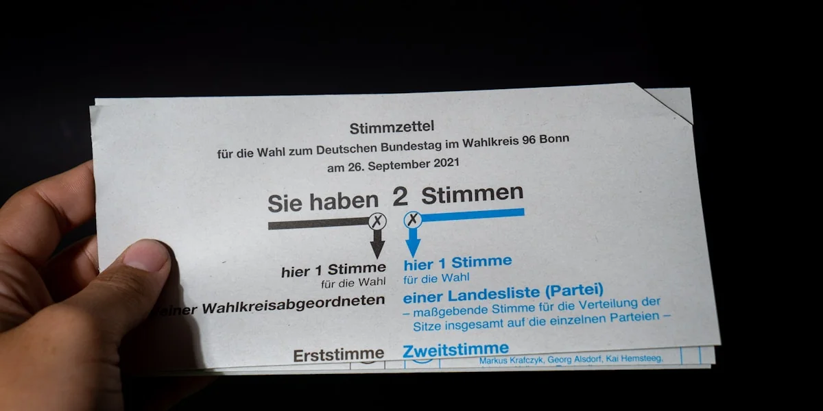 a person holding up a ticket for a concert