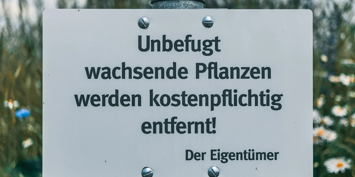 a white sign that is on a pole