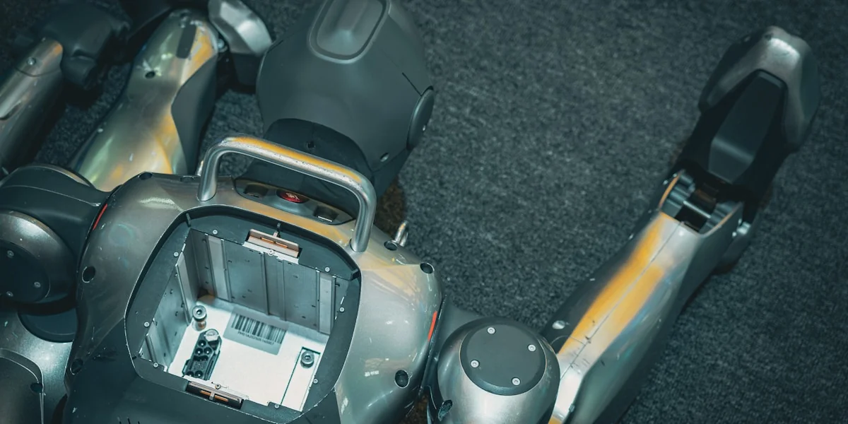 A robotic torso with exposed internal components and arms.