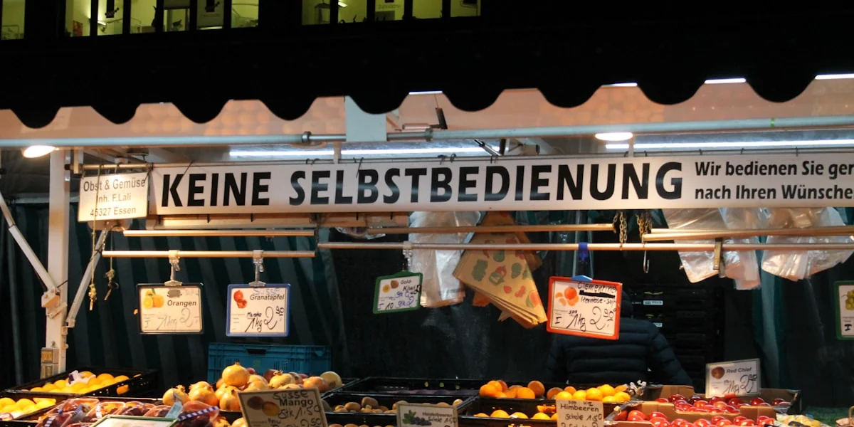 a fruit stand with various fruits and vegetables