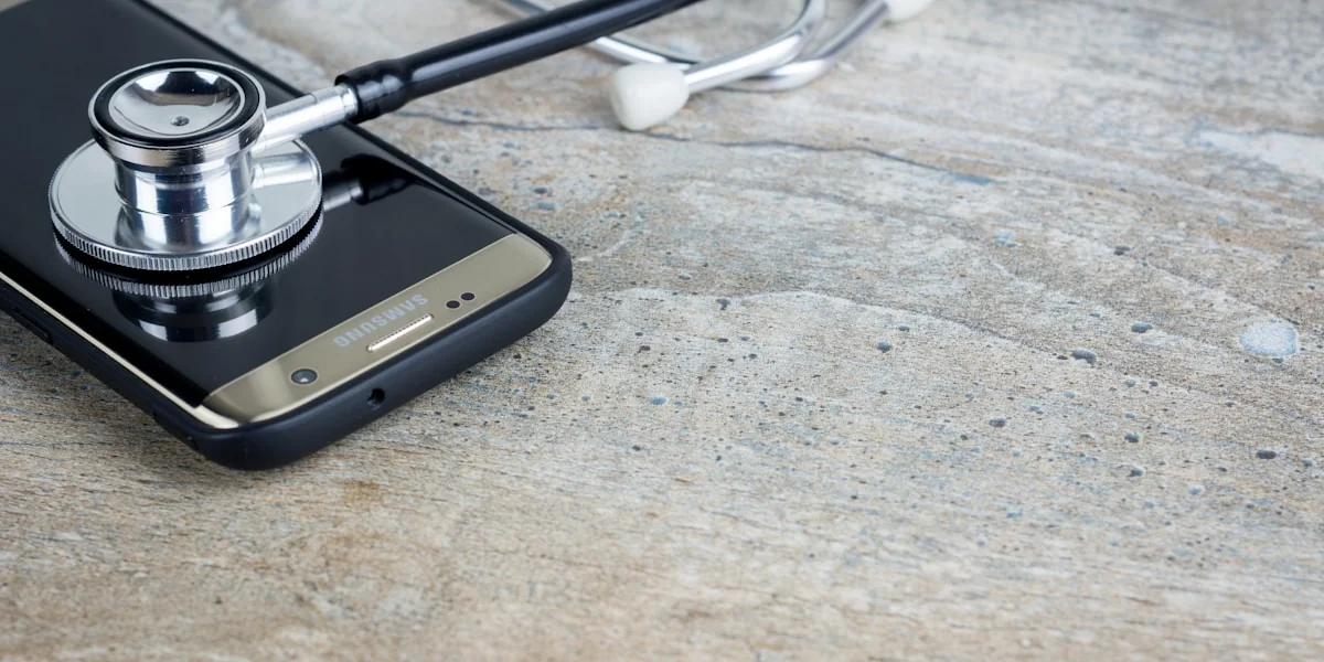 a phone with a stethoscope on top of it