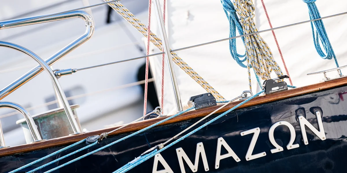 The name "amazon" written on the side of a sailboat