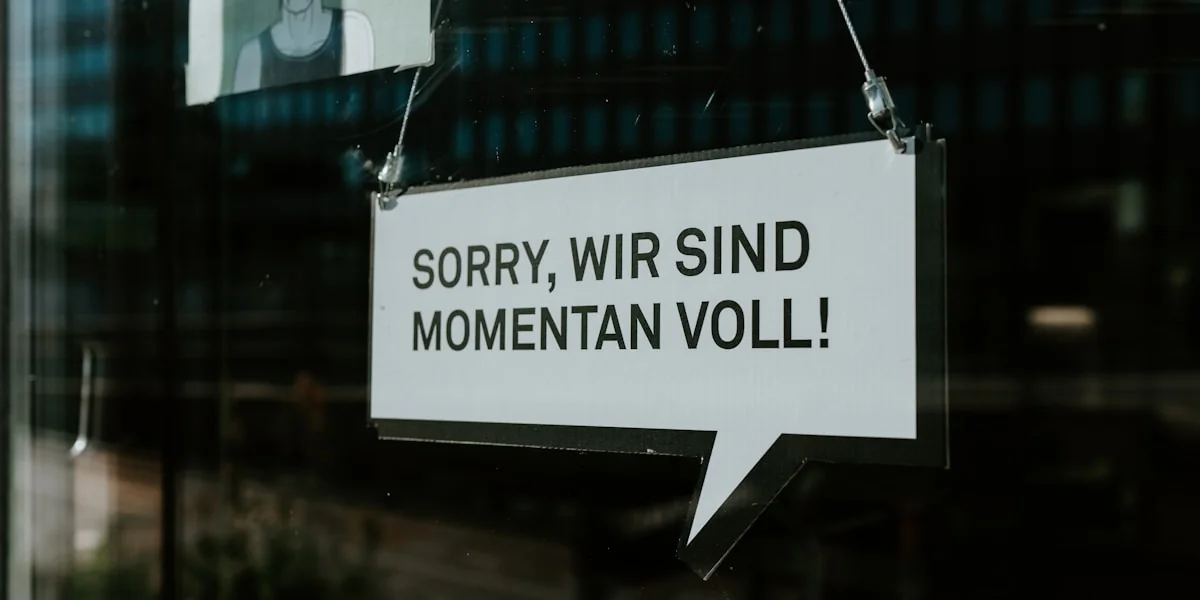 white and black wooden sign