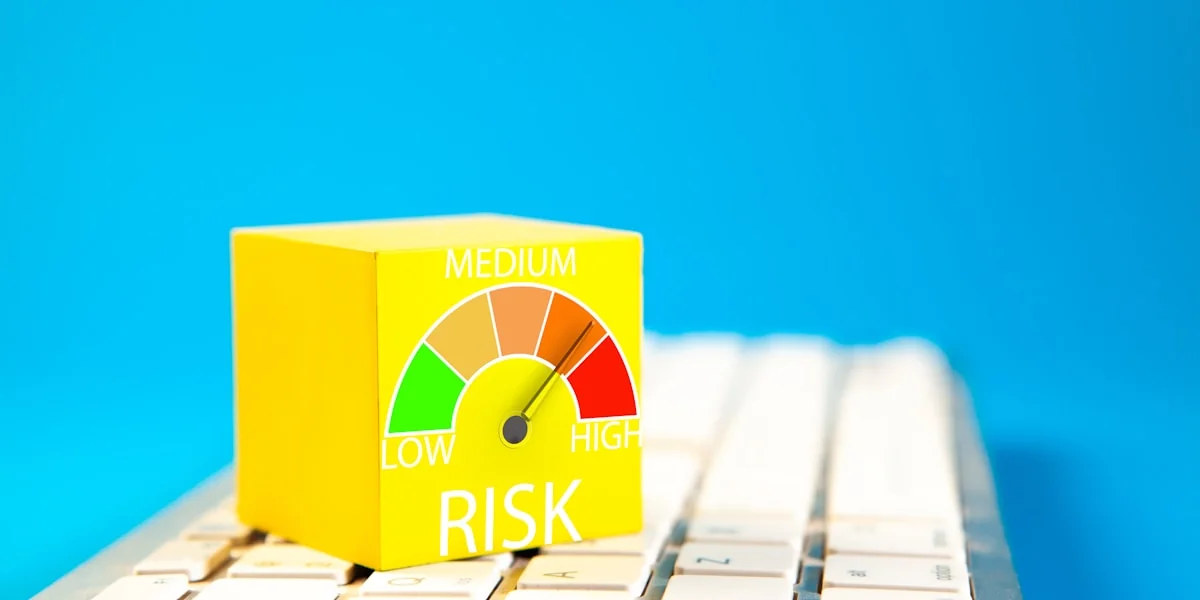 Yellow cube with risk meter on keyboard