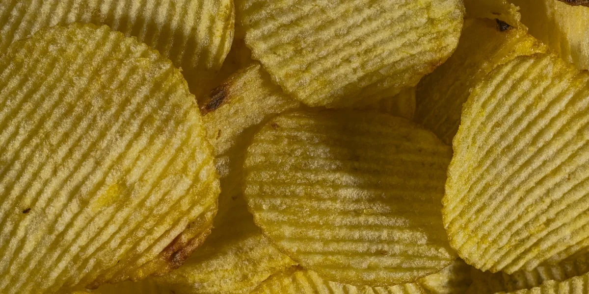 Detailed texture of crunchy ridged potato chips