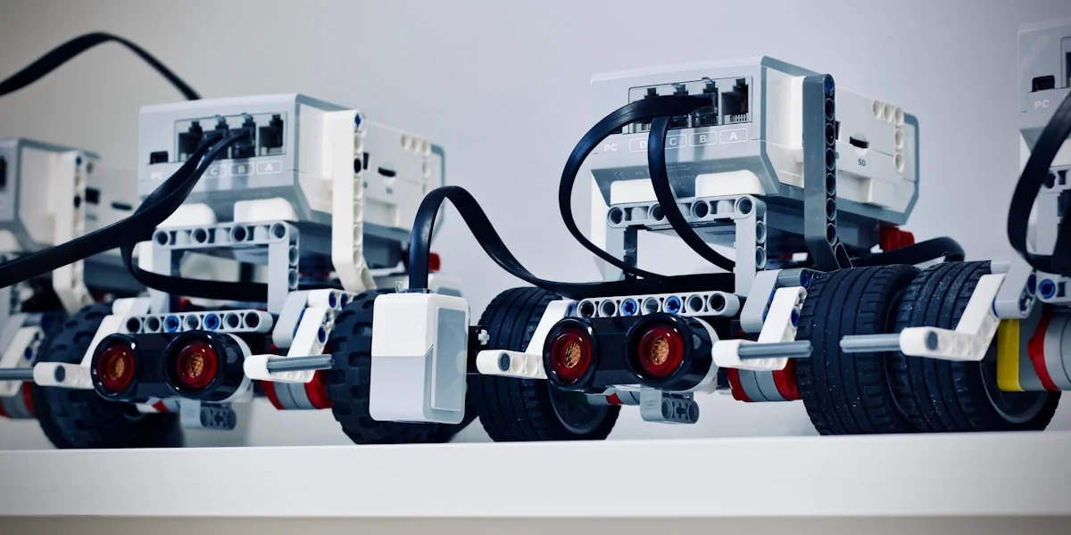two white and black electronic device with wheels