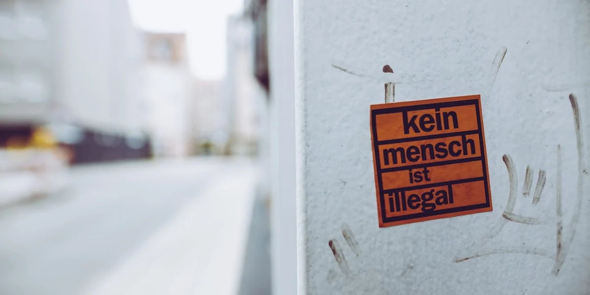kein mench ist illegal sign sticker