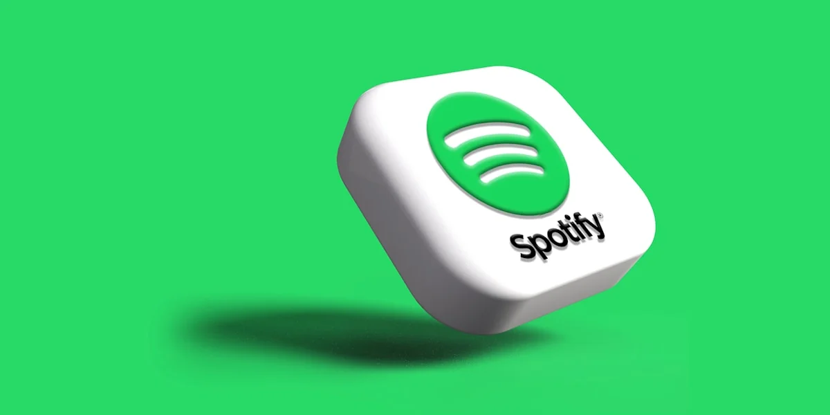 a white and green spotify logo on a green background