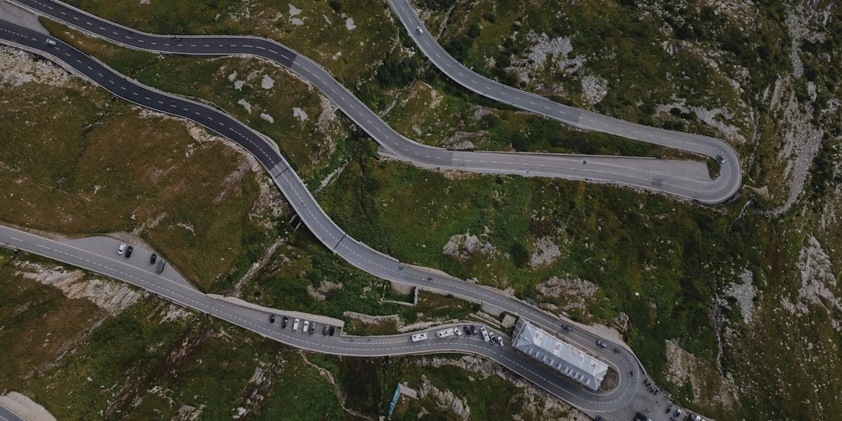 An aerial view of a winding mountain road