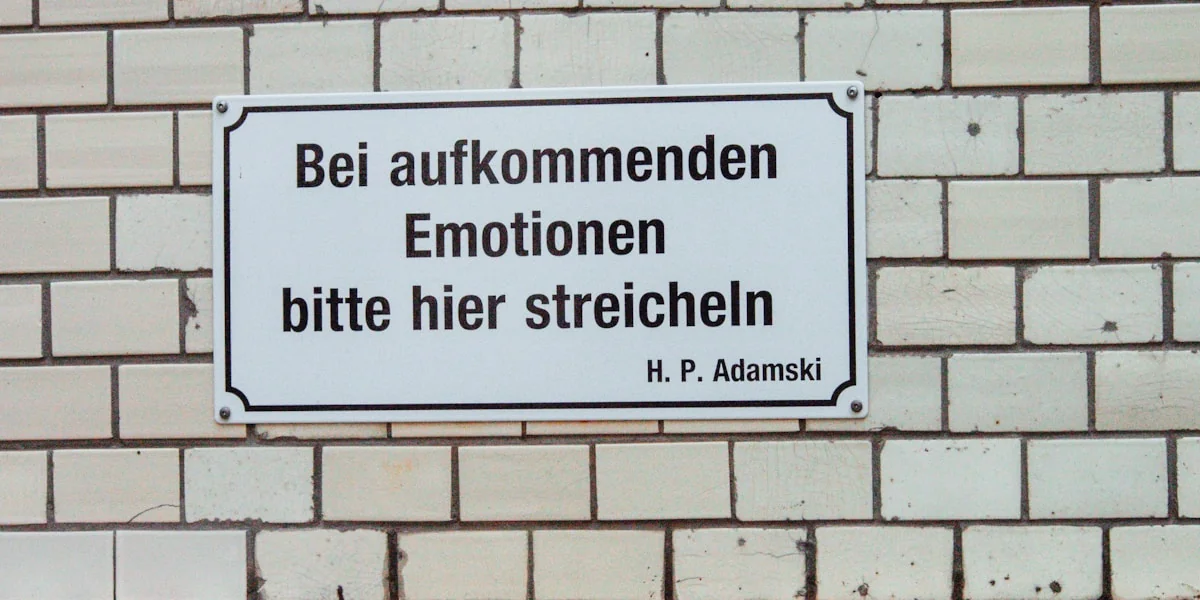 a sign on a brick wall