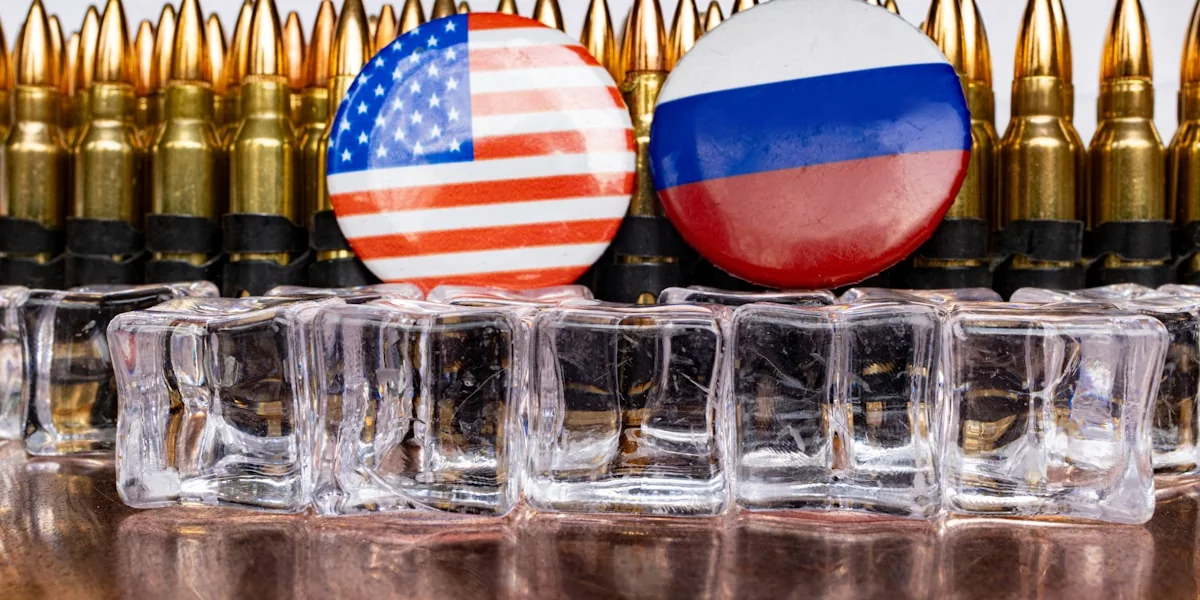 a bunch of bullet casings with flags on them