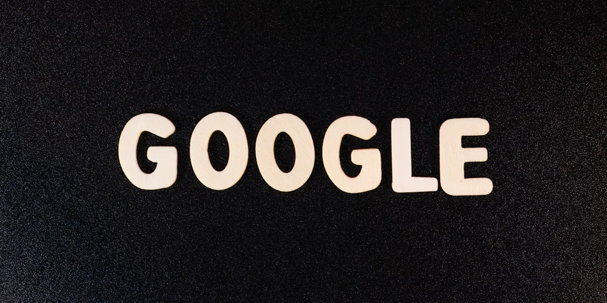 a close up of the word google on a black surface