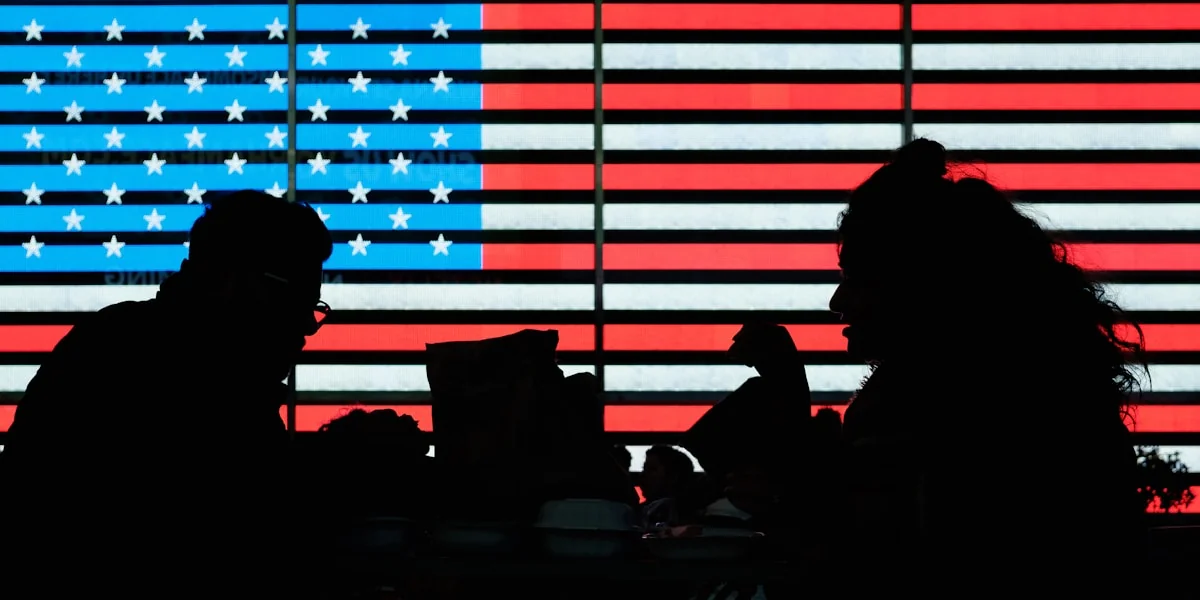 silhouette of people sitting on chair