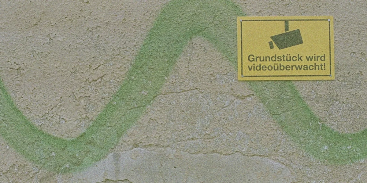 a yellow sign on the side of a building