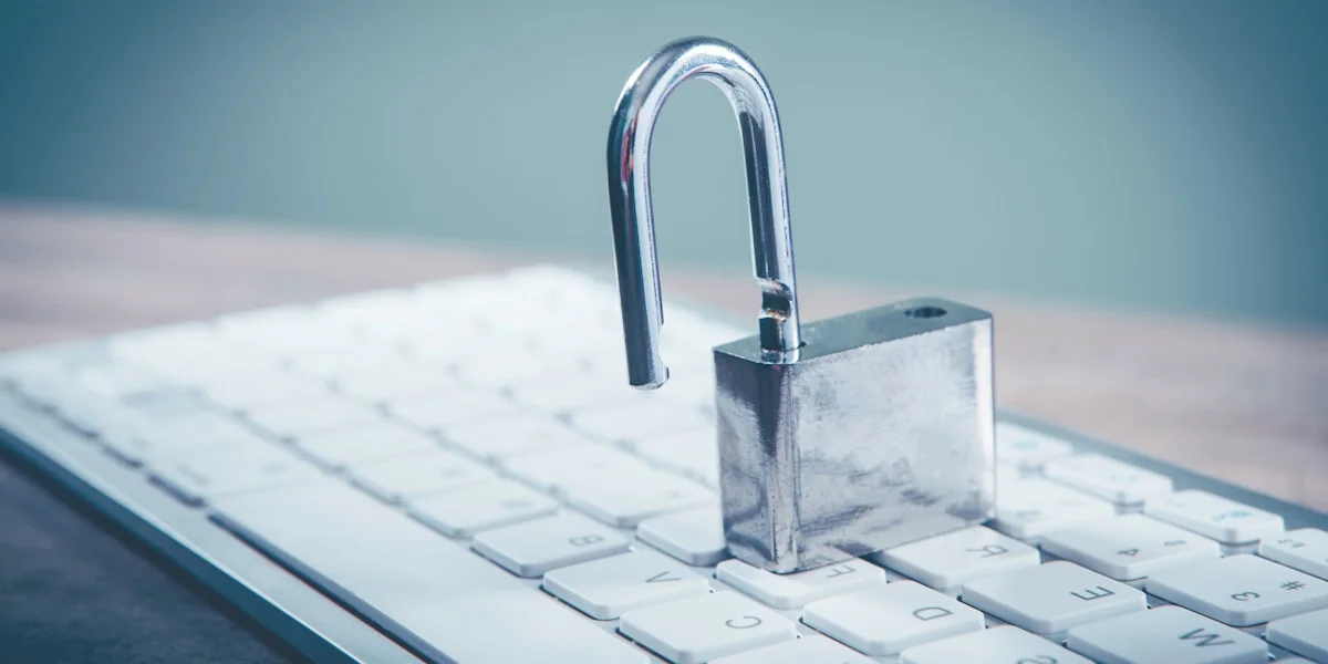 a padlock sitting on top of a computer keyboard