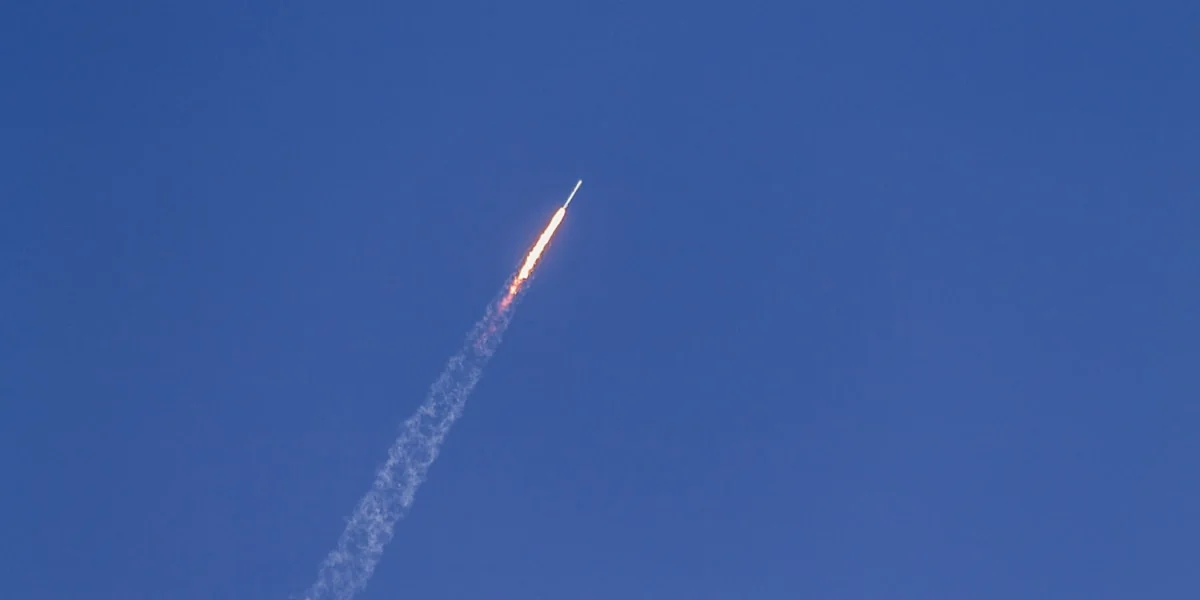 flying rocket during daytime