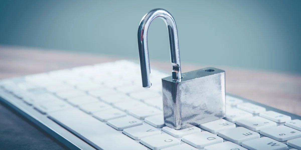a padlock sitting on top of a computer keyboard