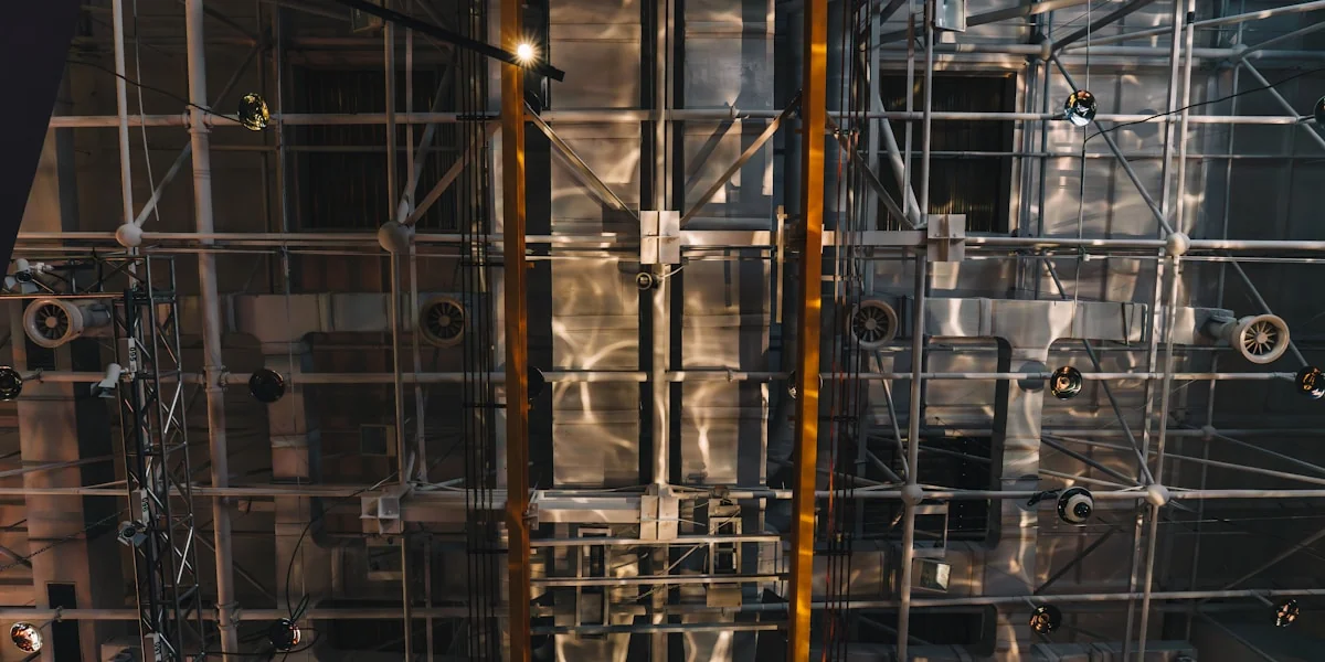 Metal scaffolding and structural components are visible.