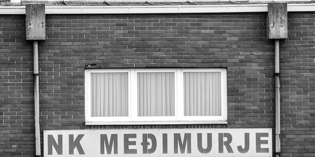 A black and white photo of a brick building