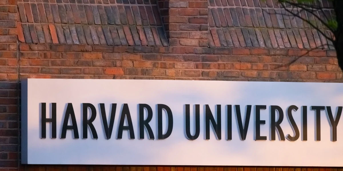 a sign on a brick wall that says harvard university
