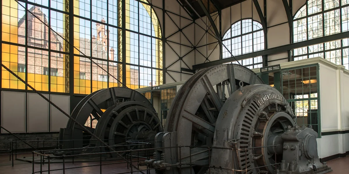 A large machine in a large room with windows