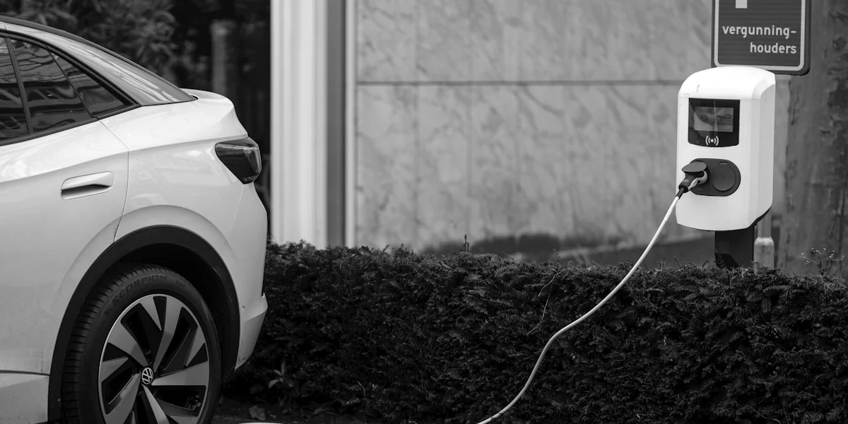 An electric car plugged into a parking meter