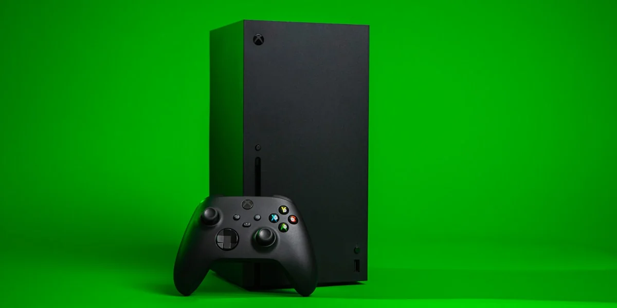 black xbox one console with controller