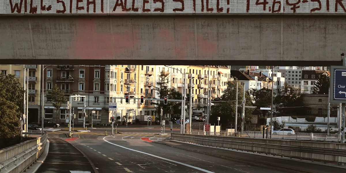 gray asphalt road under bridge