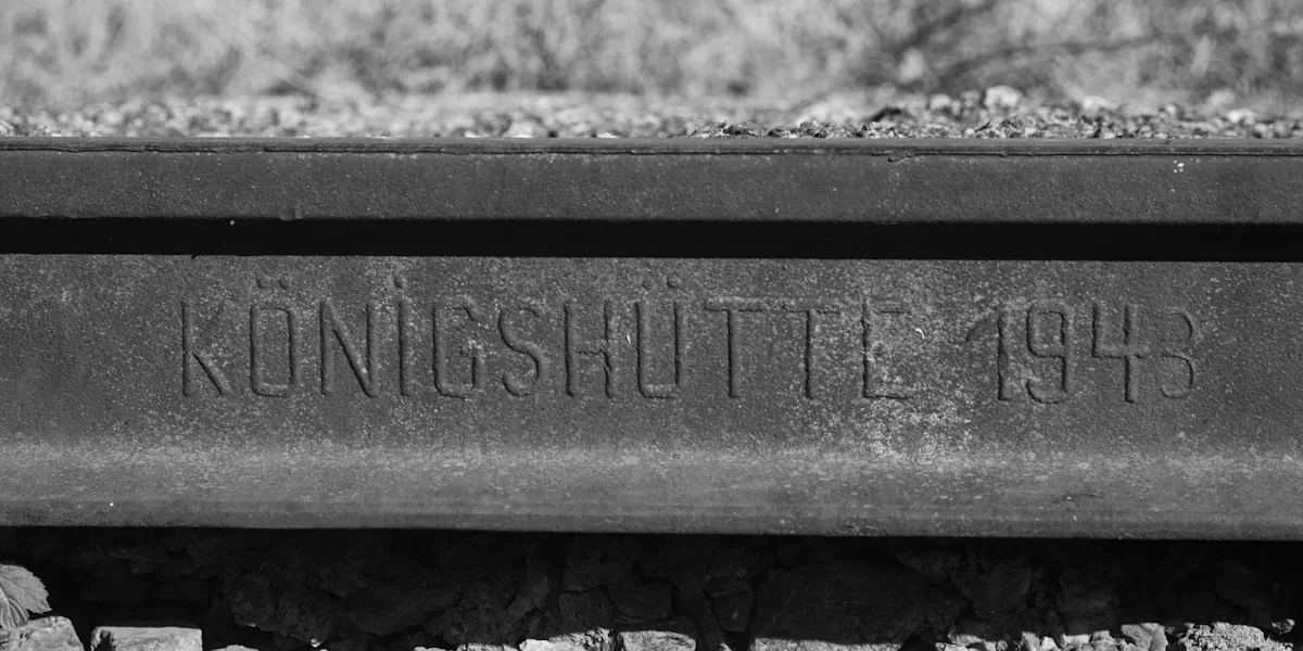 grayscale photo of wooden bench